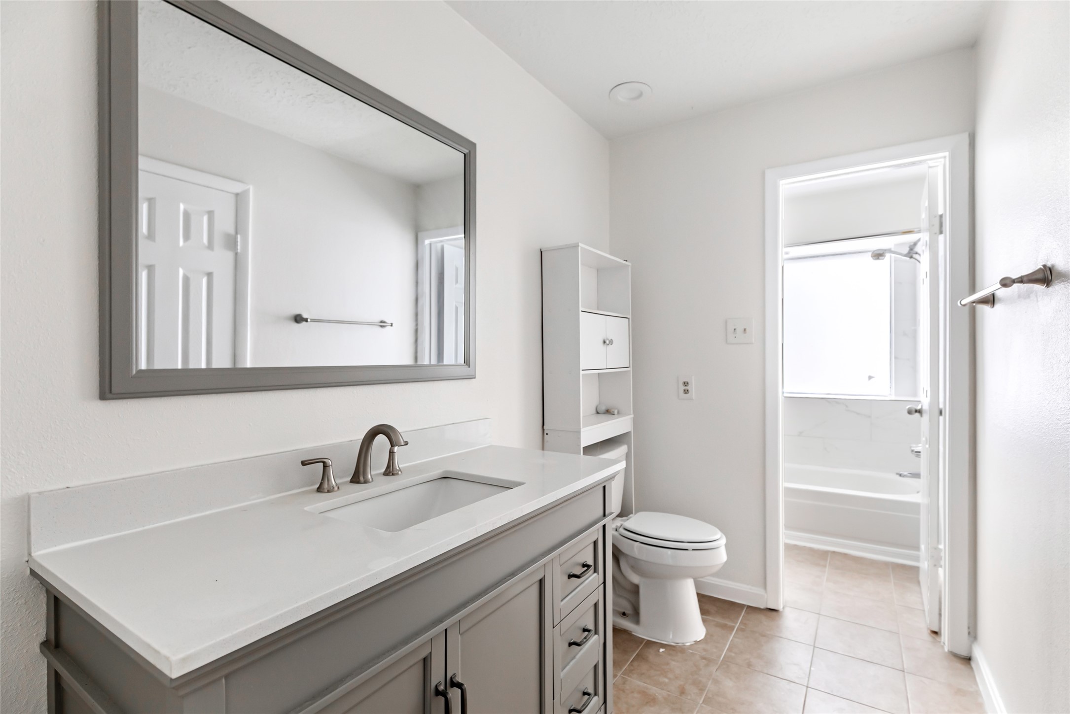 2810 Spring Dusk Drive Spring, TX 77373 - Photo 22 of 30 a bathroom with a toilet sink a mirror and shower