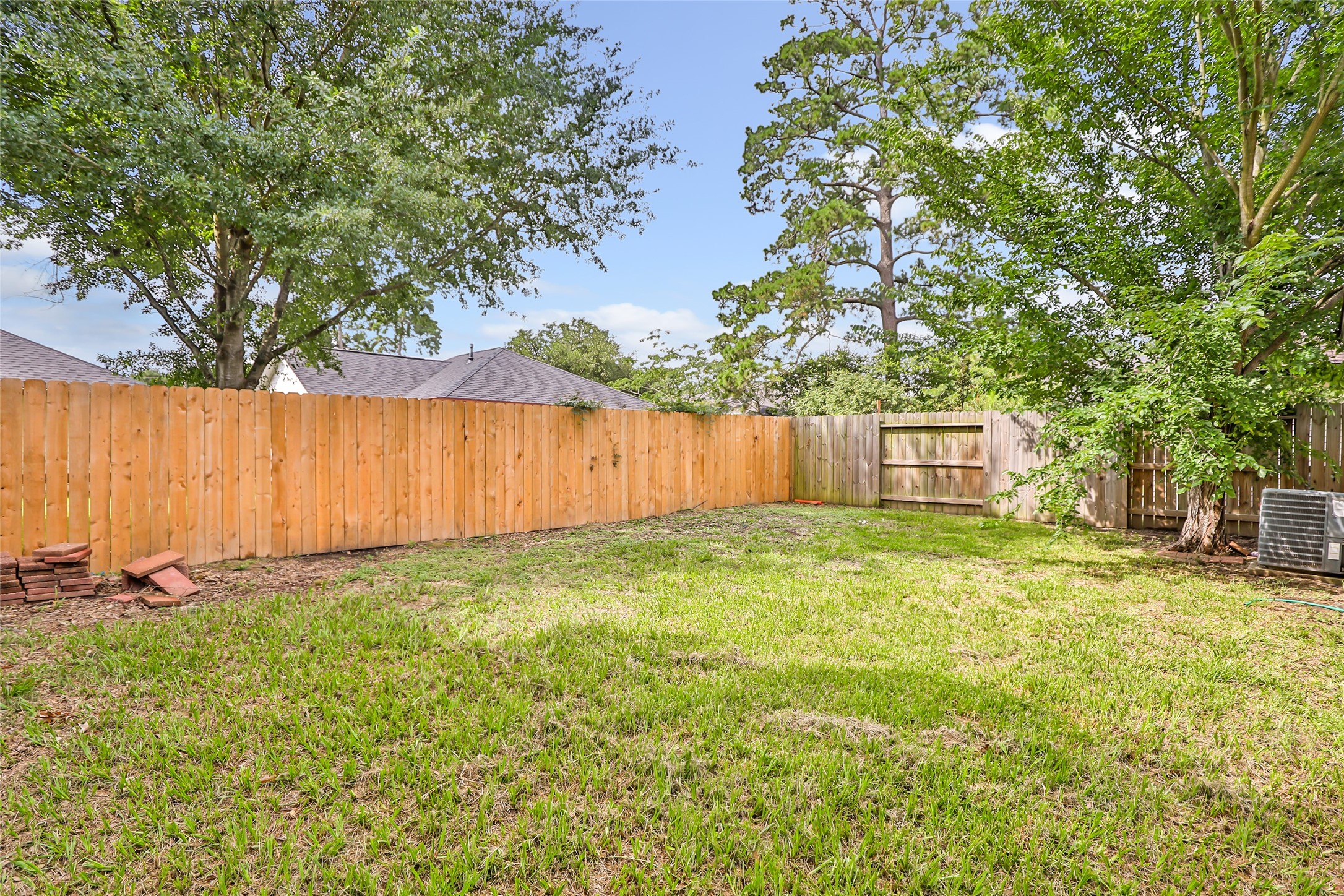 2810 Spring Dusk Drive Spring, TX 77373 - Photo 23 of 30 a backyard of a house with lots of green space