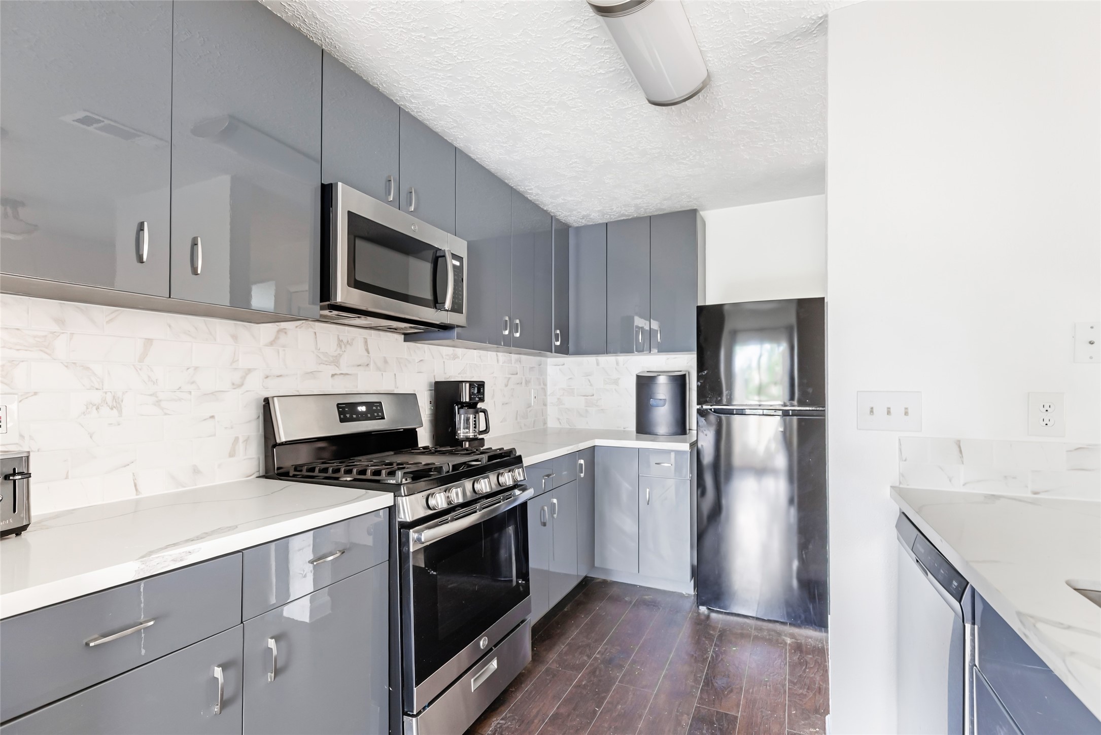 2810 Spring Dusk Drive Spring, TX 77373 - Photo 8 of 30 a kitchen with cabinets stainless steel appliances and wooden floor
