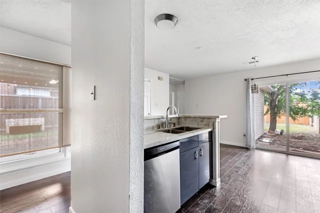 a kitchen with stainless steel appliances granite countertop a stove and a sink