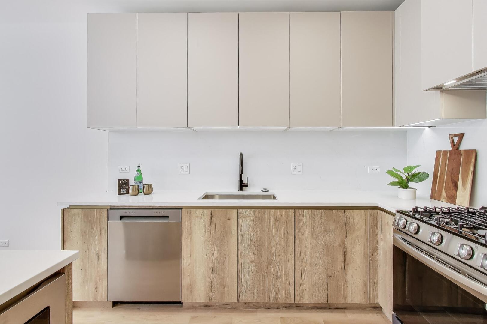 2147 West Adams Street, Unit 1S Chicago, IL 60612 - Photo 11 of 44 a kitchen with white cabinets and white appliances