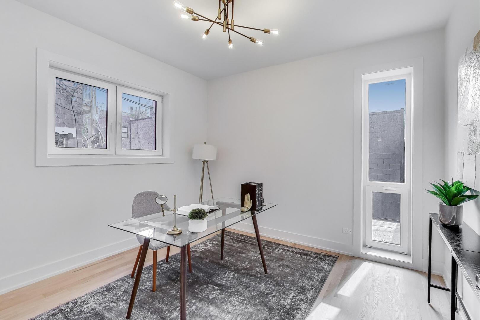 2147 West Adams Street, Unit 1S Chicago, IL 60612 - Photo 13 of 44 a workspace room with furniture and wooden floor