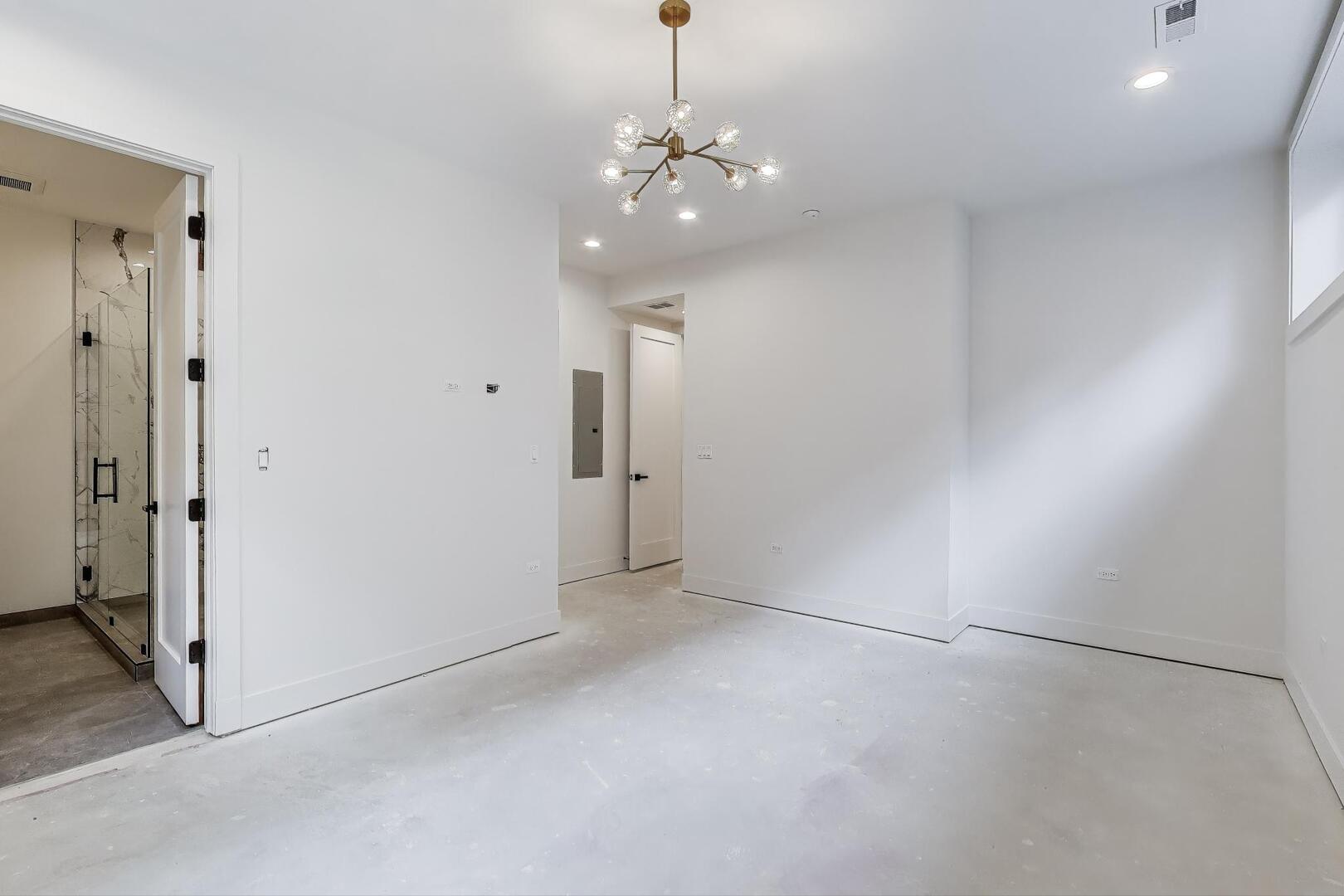 2147 West Adams Street, Unit 1S Chicago, IL 60612 - Photo 18 of 44 a view of a chandelier in big room and chandelier fan