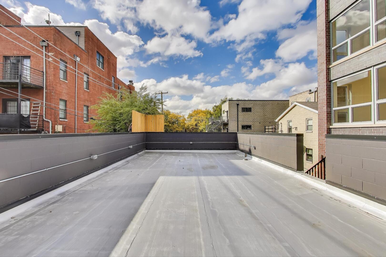 2147 West Adams Street, Unit 1S Chicago, IL 60612 - Photo 32 of 44 a view of a city from a balcony