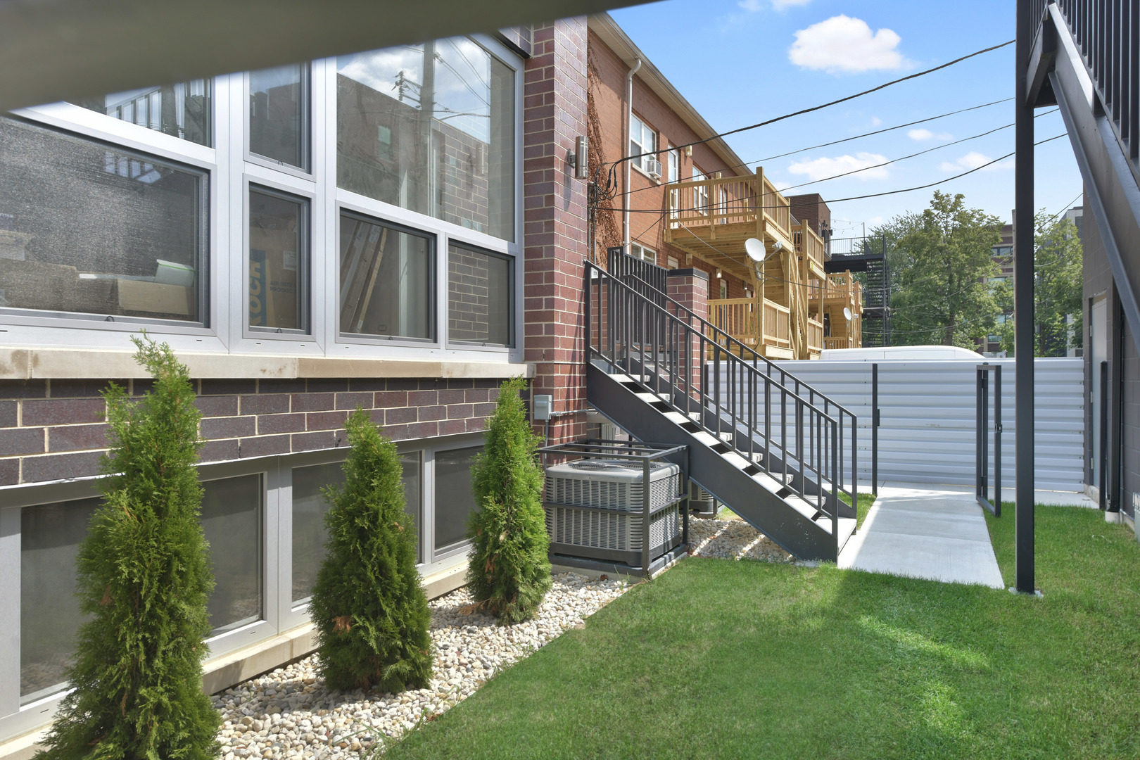 2147 West Adams Street, Unit 1S Chicago, IL 60612 - Photo 37 of 44 a view of a house with a yard and sitting area