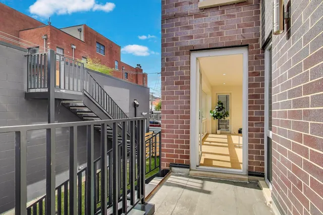 a view of front door of house with stairs