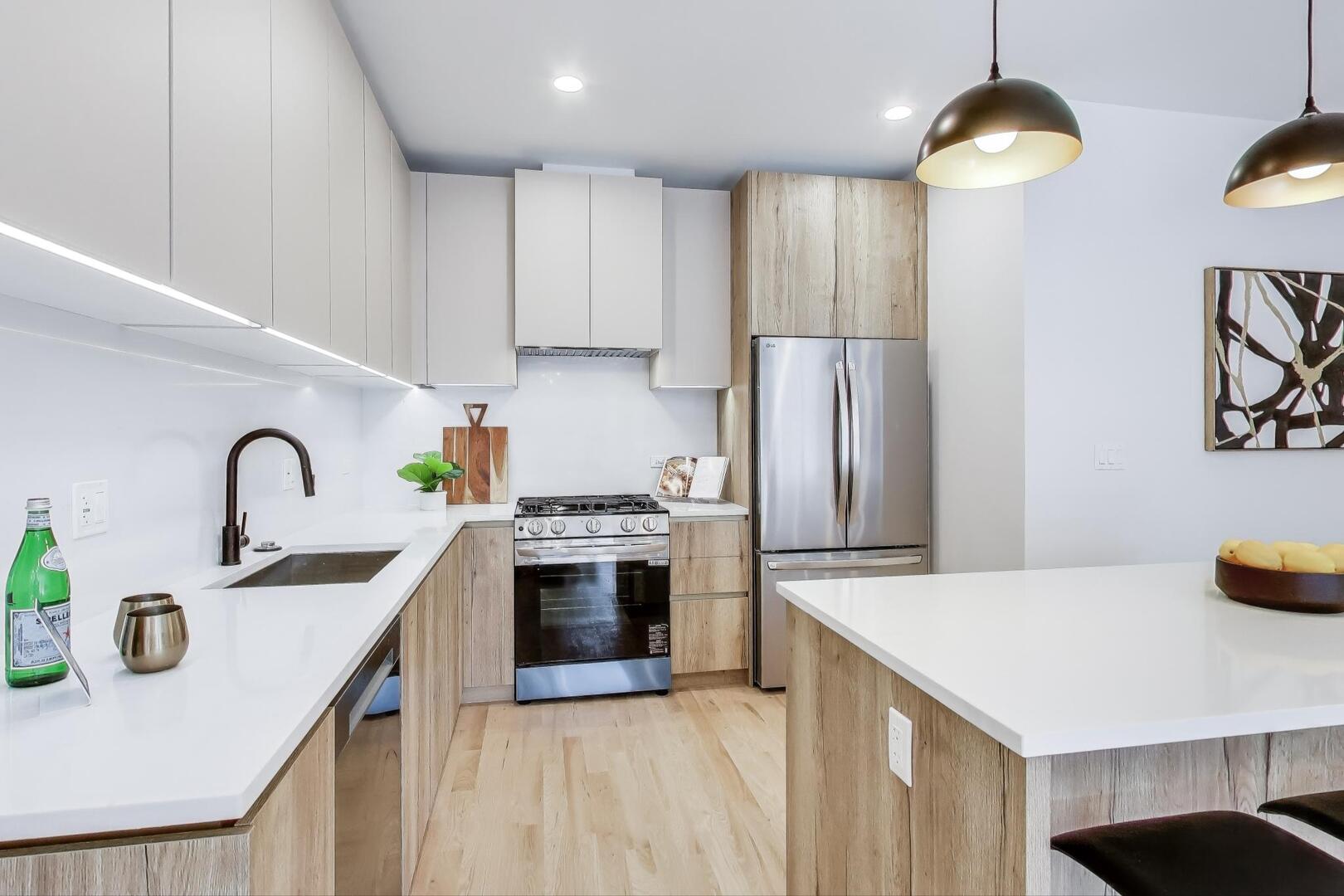 2147 West Adams Street, Unit 1S Chicago, IL 60612 - Photo 9 of 44 a kitchen with stainless steel appliances granite countertop a sink stove and refrigerator