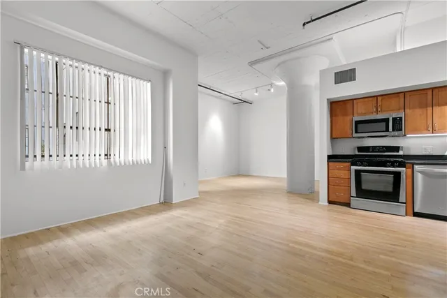 a view of an empty room with a window