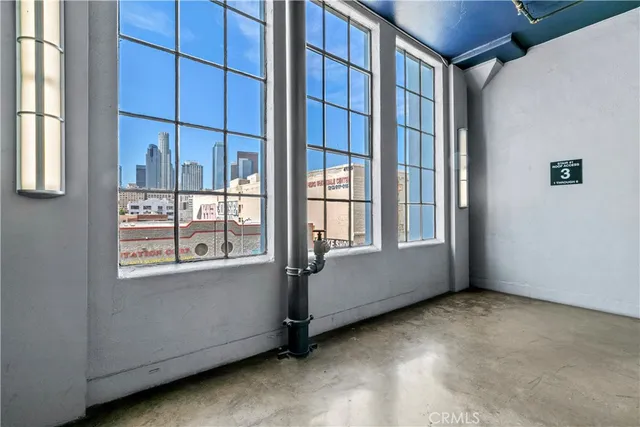 a green field with some trees in the background