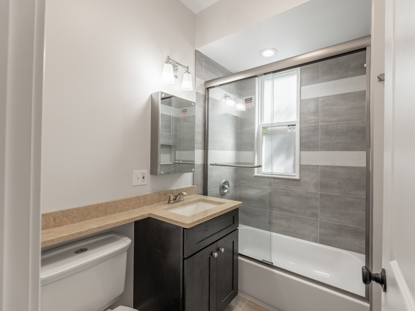 2940 West Pershing Road Chicago, IL 60632 - Photo 7 of 11 a bathroom with a sink and a mirror