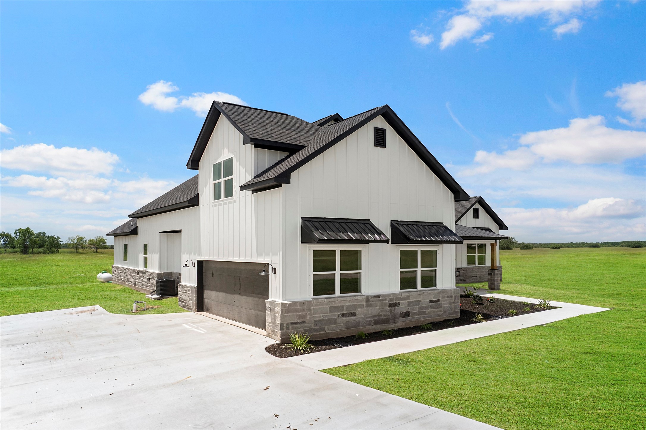 413 Chuckwagon Trail Angleton, TX 77515 - Photo 2 of 46 a front view of a house with a yard