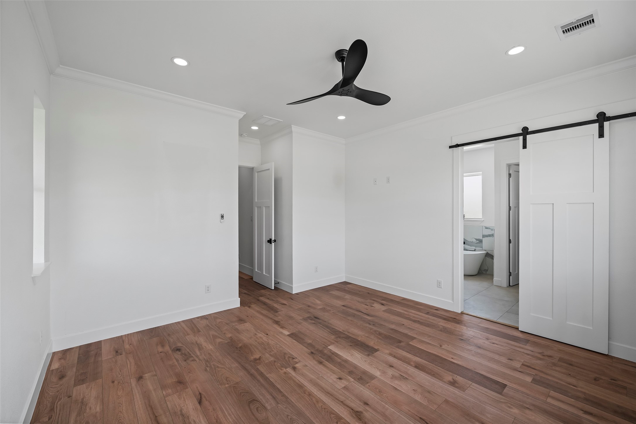 413 Chuckwagon Trail Angleton, TX 77515 - Photo 23 of 46 a view of empty room with wooden floor