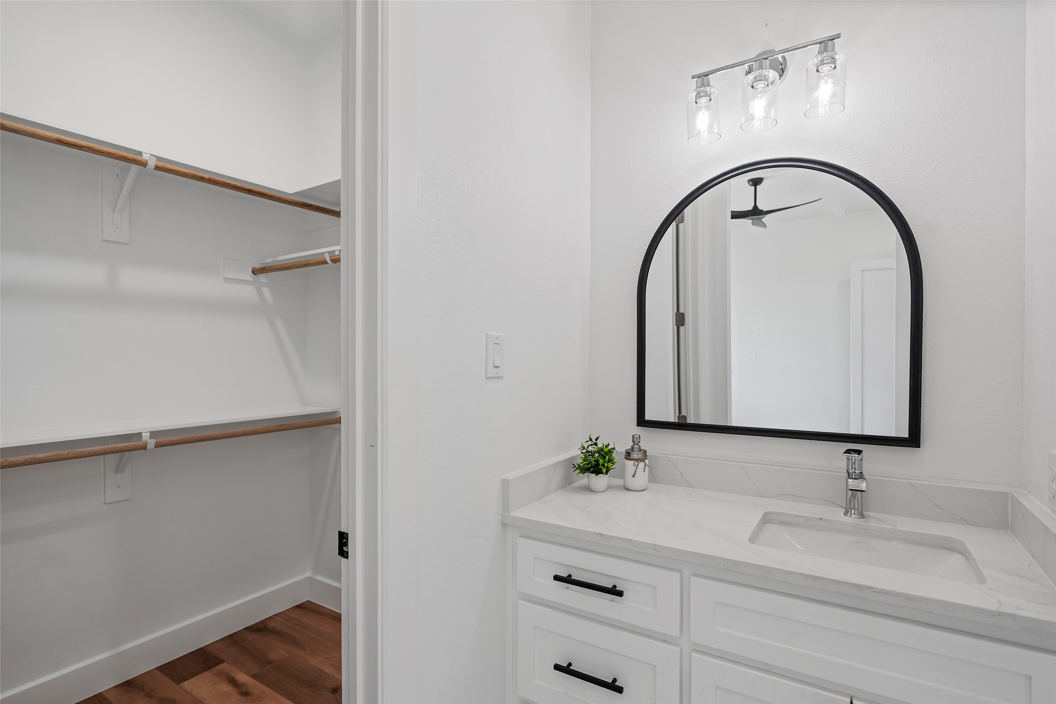 413 Chuckwagon Trail Angleton, TX 77515 - Photo 43 of 46 a bathroom with a granite countertop sink and a mirror