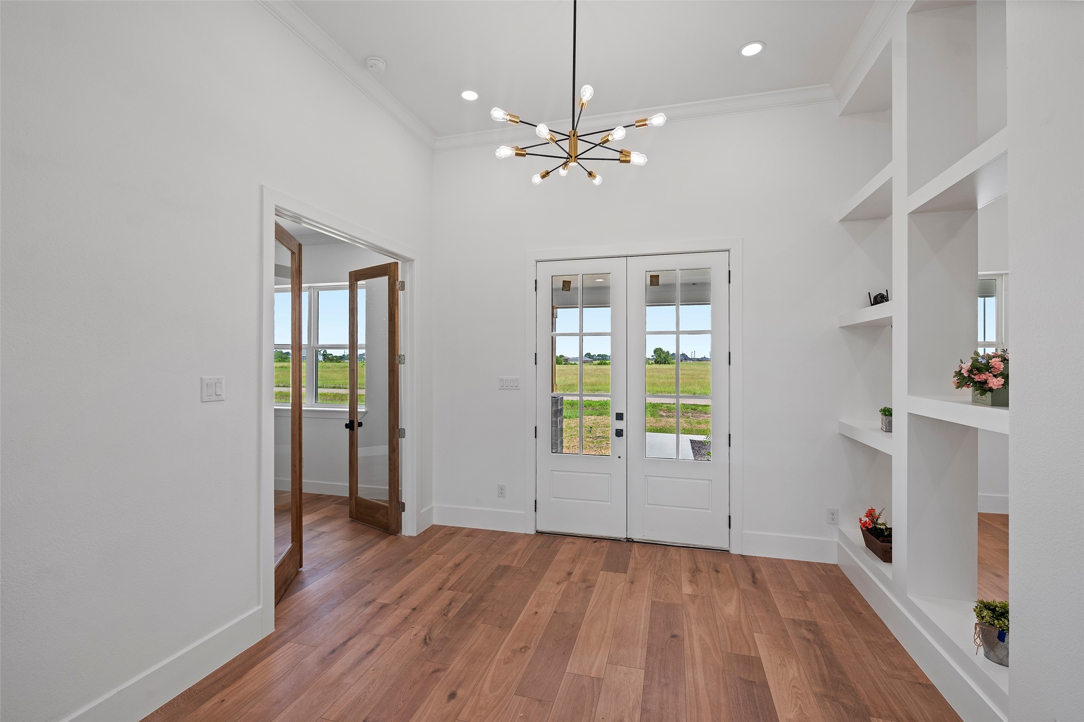 413 Chuckwagon Trail Angleton, TX 77515 - Photo 6 of 46 wooden floor in an empty room with a window
