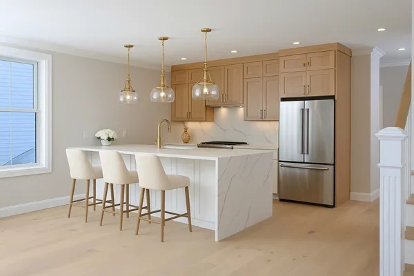 a kitchen with stainless steel appliances granite countertop a refrigerator a sink a stove and white cabinets