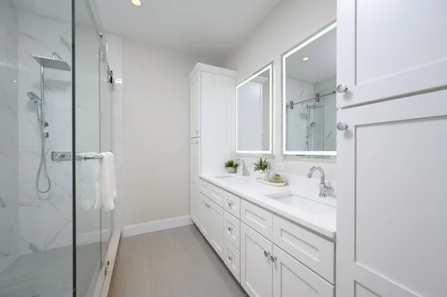 an empty room with windows and closet