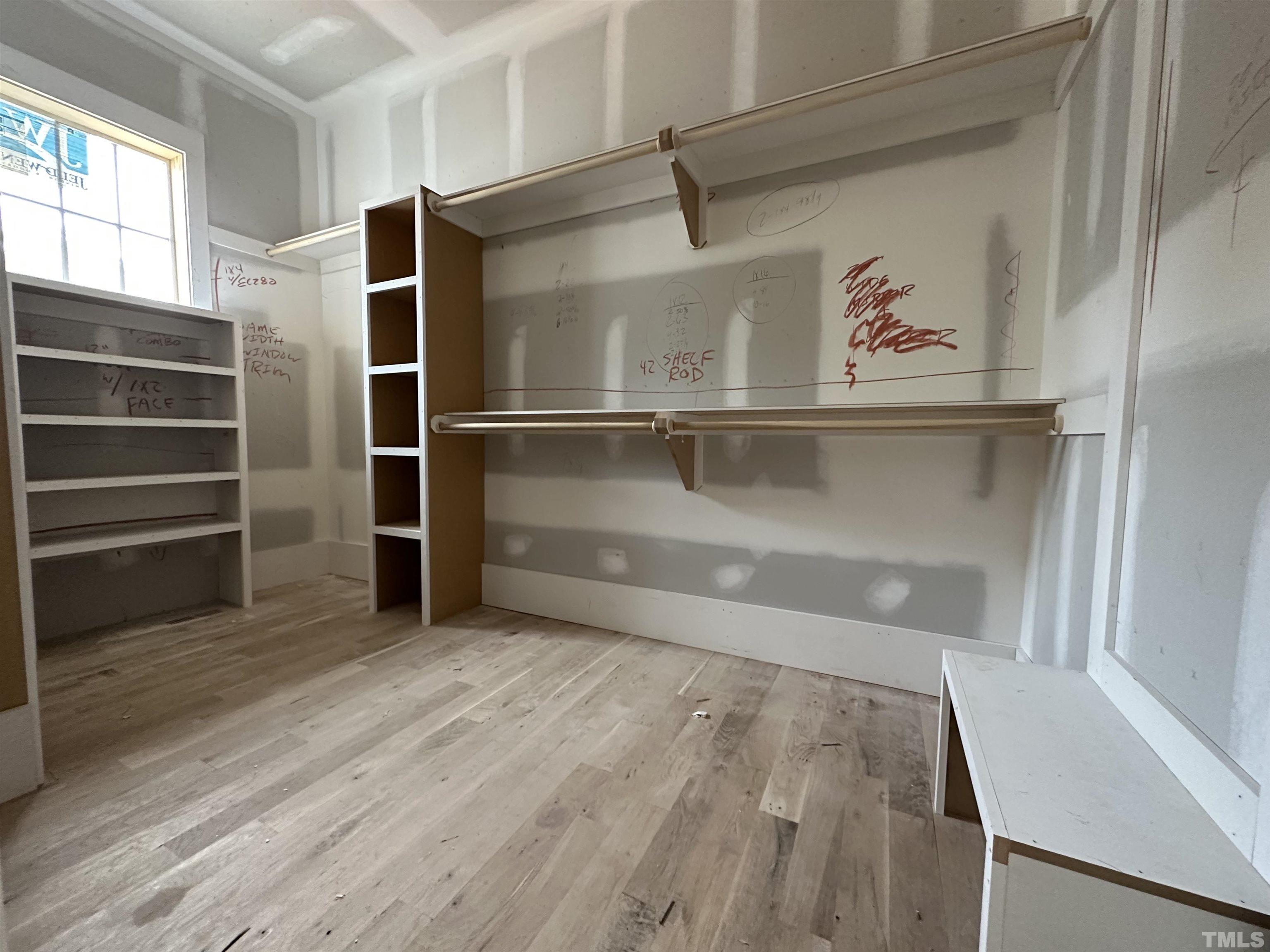 1509 Starry Night Court Raleigh, NC 27613 - Photo 6 of 14 a view of walk in closet with empty racks