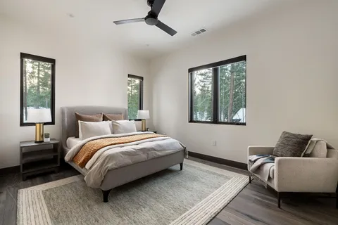 a bedroom with bed and a window