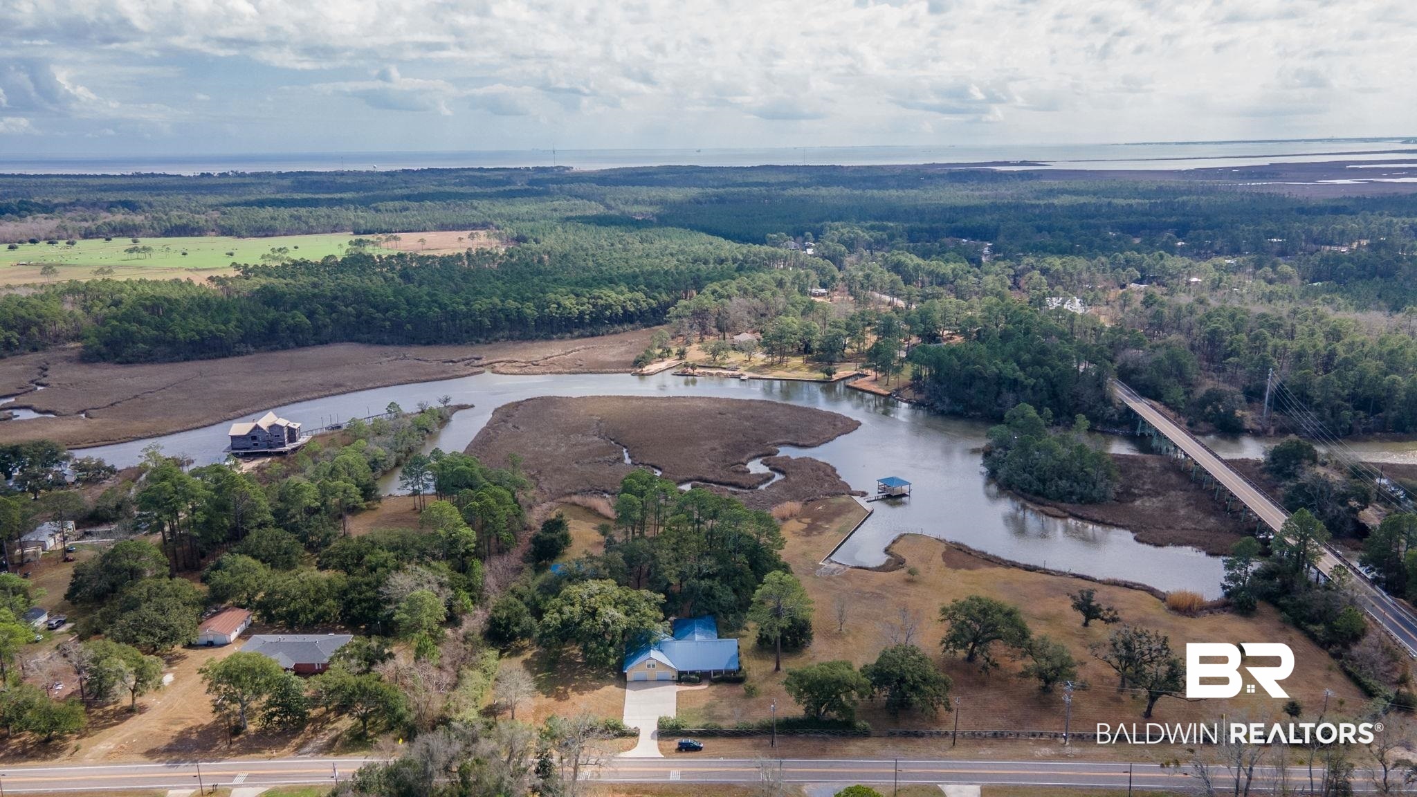 15025 Bellingrath Road Coden, AL 36523 - Photo 1 of 79 Aerial view of a nearby body of water and a forest