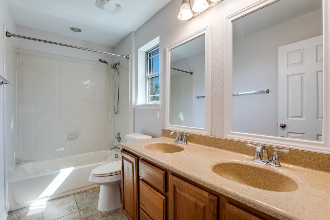 211 Mancos Drive Georgetown, TX 78626 - Photo 9 of 25 a bathroom with a granite countertop sink toilet and shower