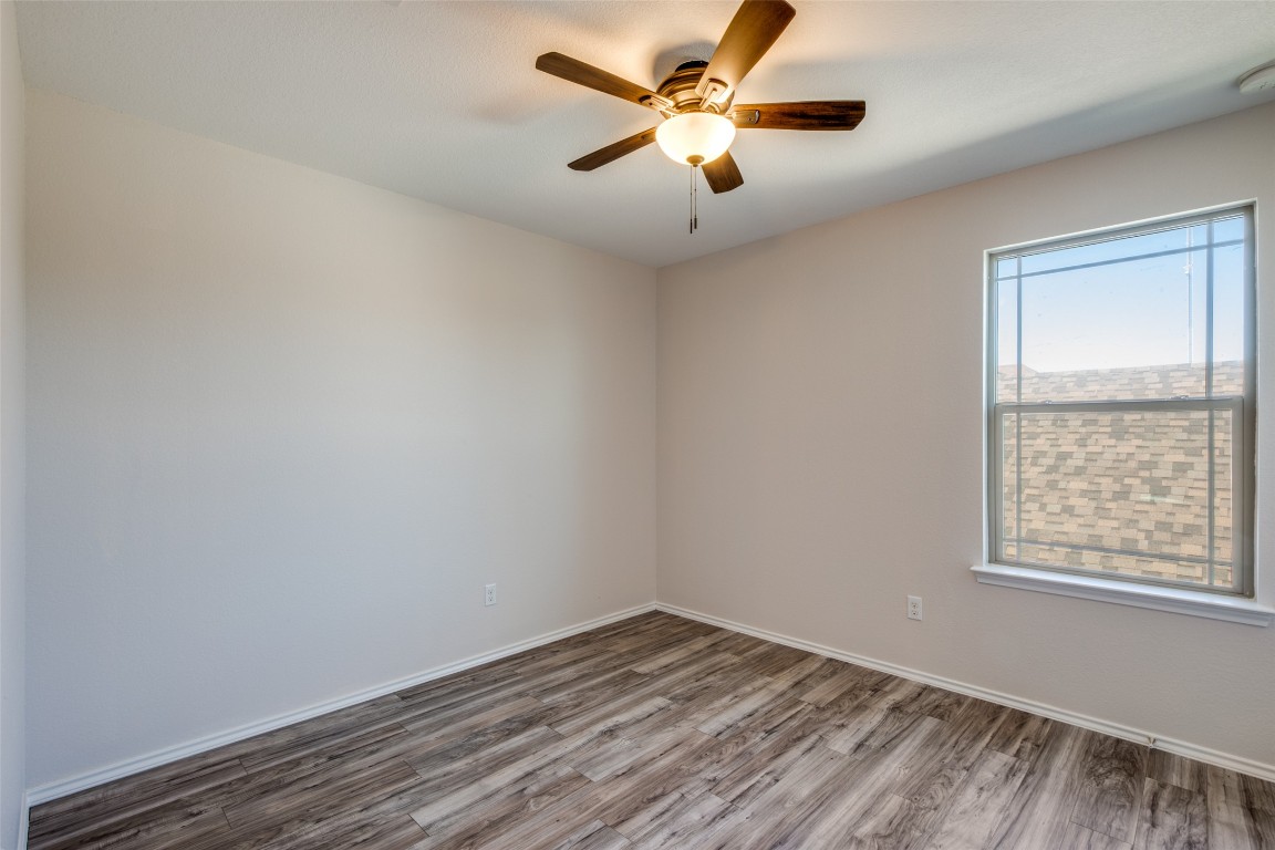 211 Mancos Drive Georgetown, TX 78626 - Photo 11 of 25 an empty room with a window and a fan