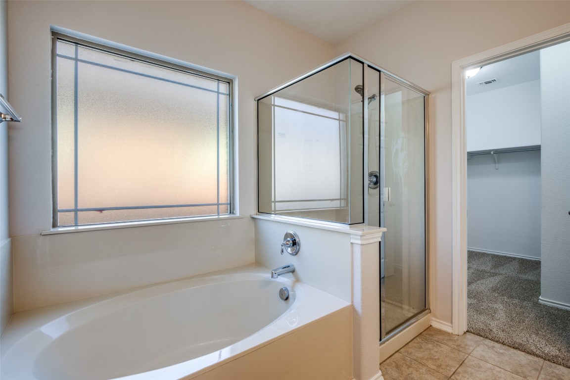 211 Mancos Drive Georgetown, TX 78626 - Photo 16 of 25 a bathroom with a shower and a bathtub