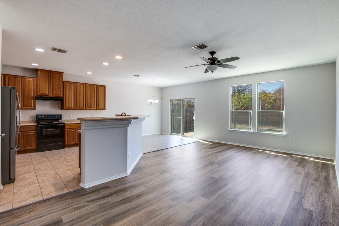 211 Mancos Drive Georgetown, TX 78626 - Photo 24 of 25 a view of kitchen with cabinets and wooden floor