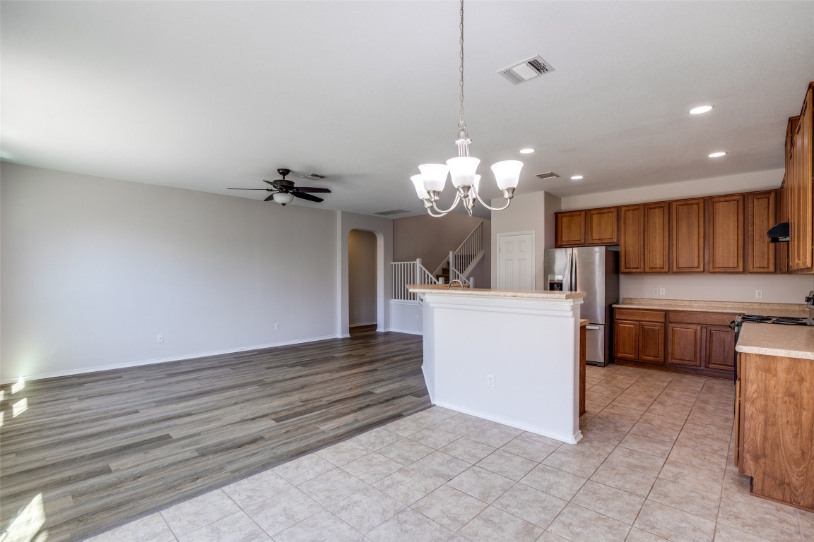 211 Mancos Drive Georgetown, TX 78626 - Photo 4 of 25 a view of a kitchen with a sink and chandelier