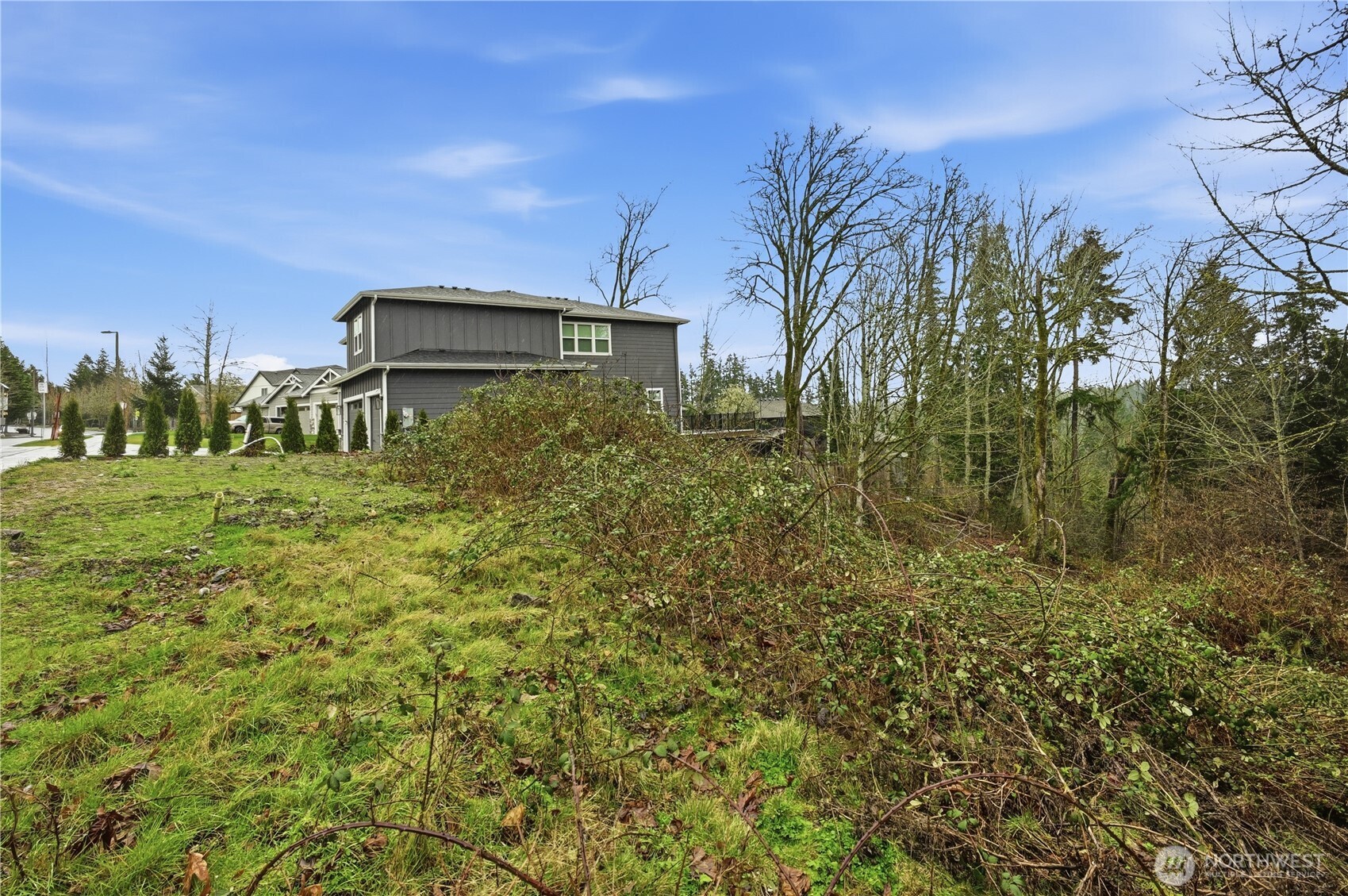 13655 Southeast 88th Way Newcastle, WA 98059 - Photo 23 of 29 a yellow house with trees in front of it