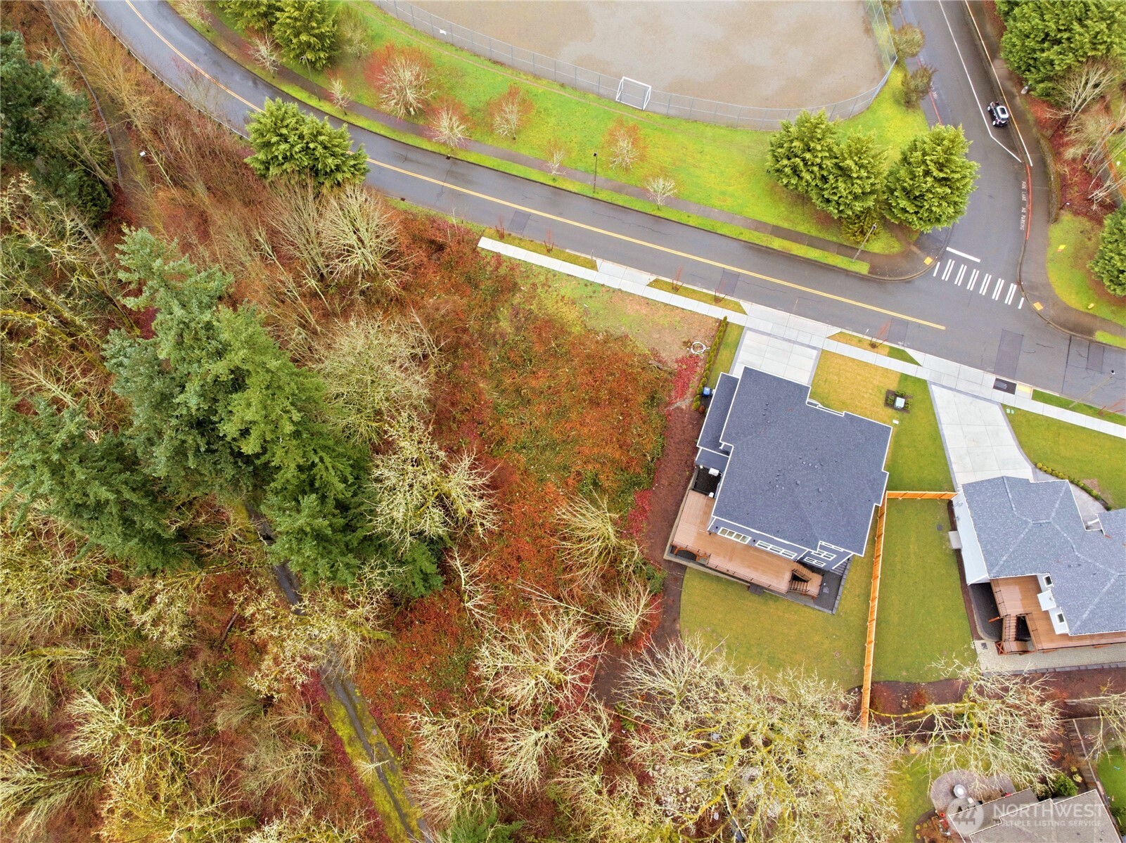 13655 Southeast 88th Way Newcastle, WA 98059 - Photo 5 of 29 a aerial view of a house with swimming pool and large trees