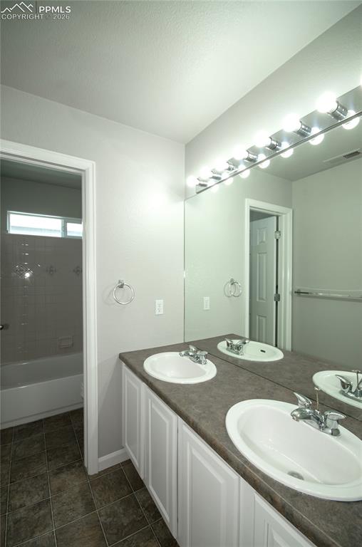 9443 St.George Road Peyton, CO 80831 - Photo 32 of 45 a bathroom with a sink and a mirror