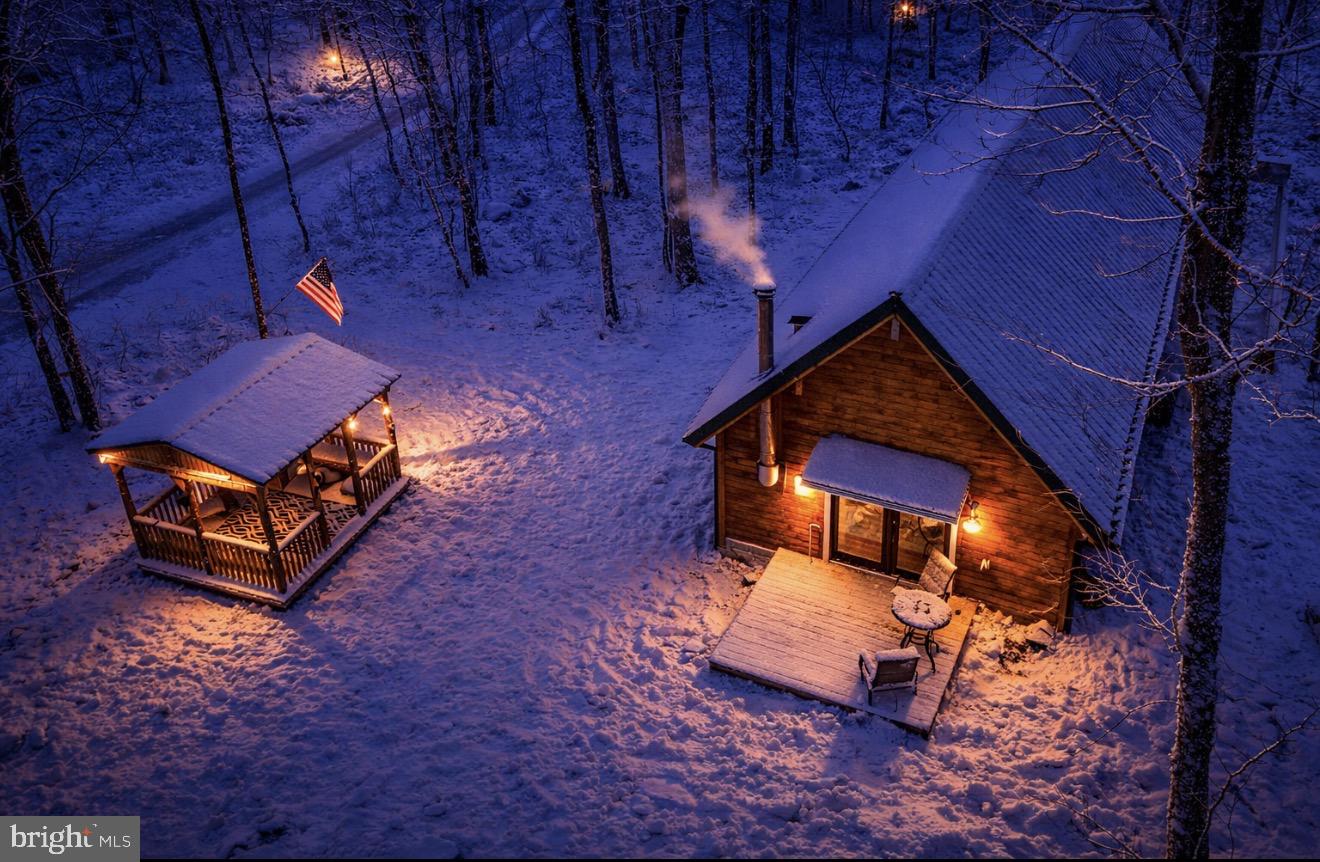 a view of a backyard with wooden fence