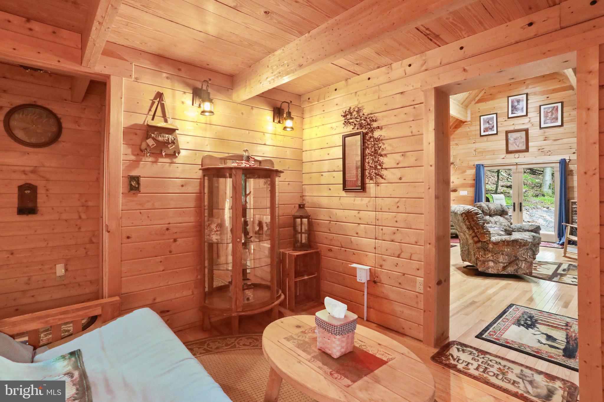 333 Rouse Mountain Road Great Cacapon, WV 25422 - Photo 25 of 54 a bathroom with a sink and a mirror