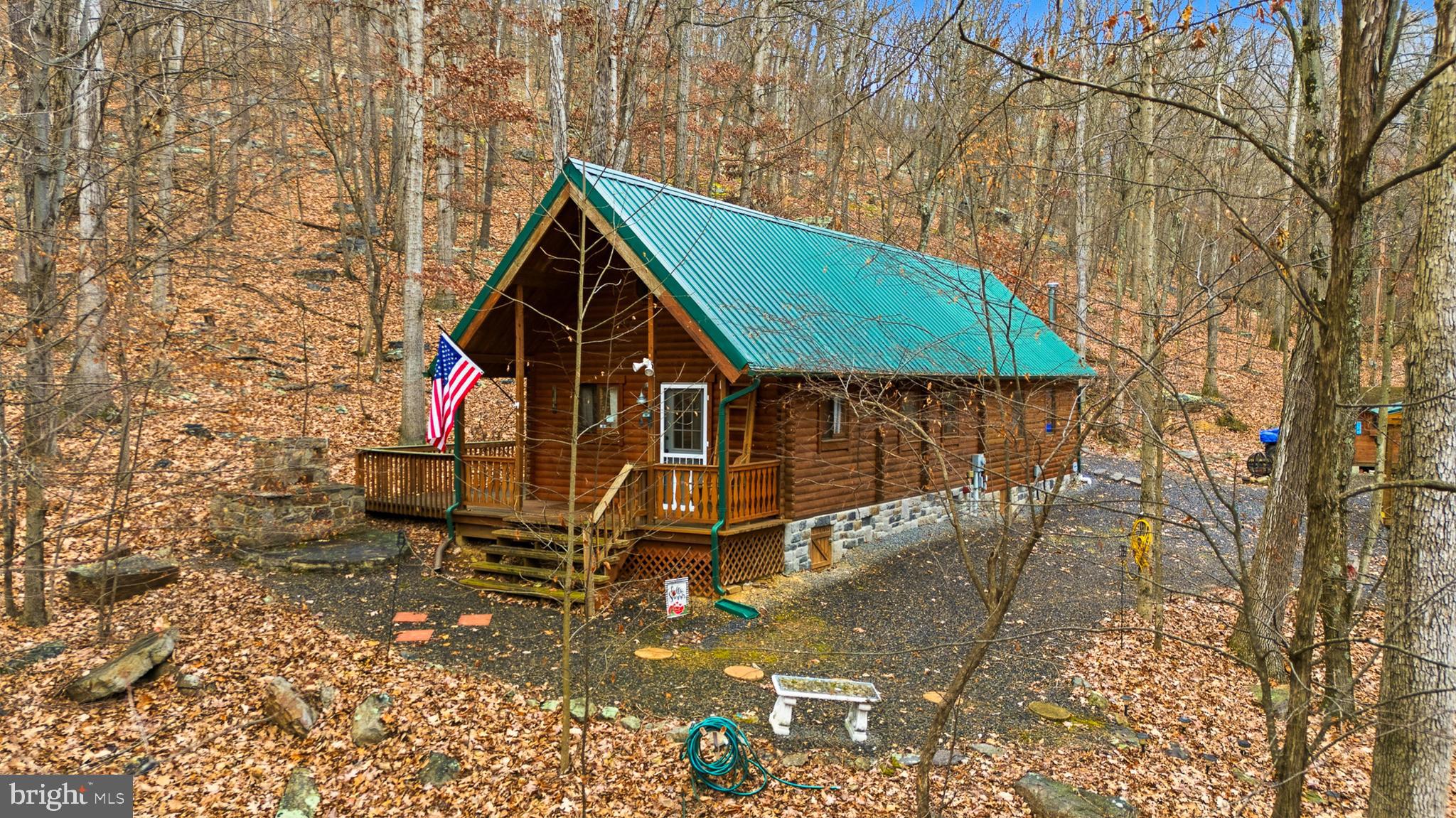 333 Rouse Mountain Road Great Cacapon, WV 25422 - Photo 54 of 54 a view of house with a yard