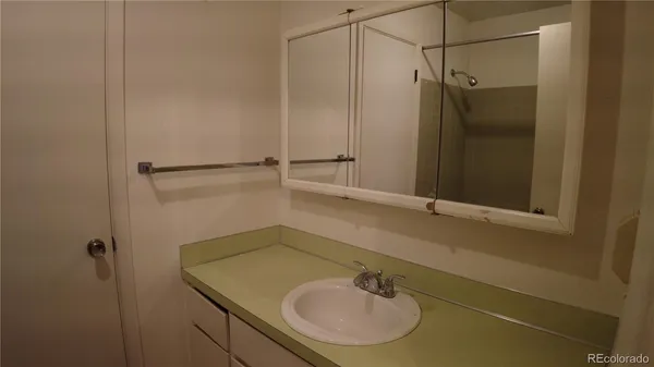 a bathroom with a sink and mirror