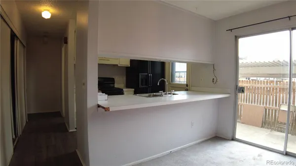 a view of living room with furniture and a flat screen tv