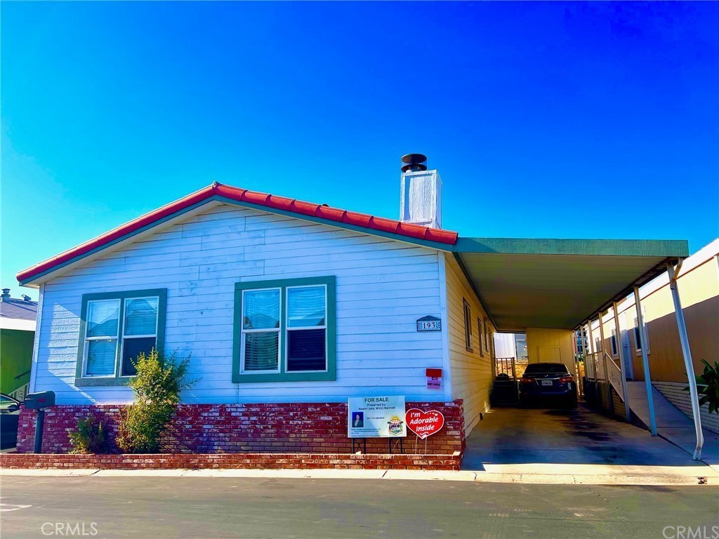 1051 Site Drive, Unit 193 Brea, CA 92821 - Photo 1 of 1 a front view of a house with garage