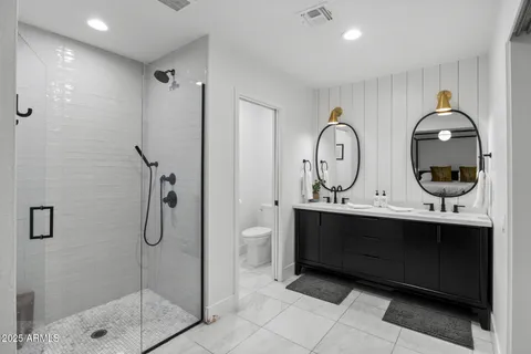 a view of bathroom with dual sinks