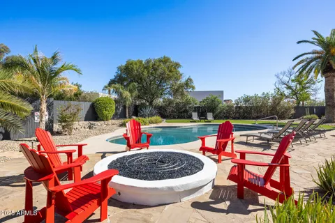 a view of a backyard with a garden and entertaining space