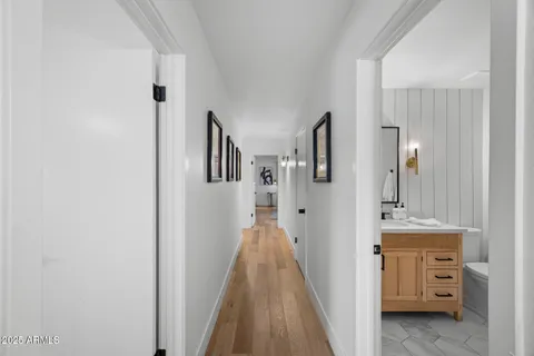 a view of a hallway with a dresser