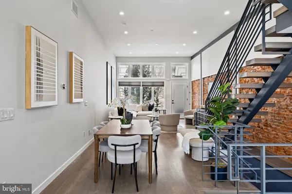 a kitchen with a table and chairs in it