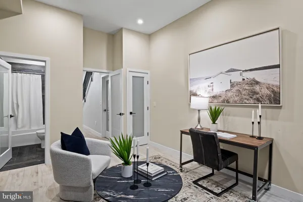 a view of a hallway with washer and dryer