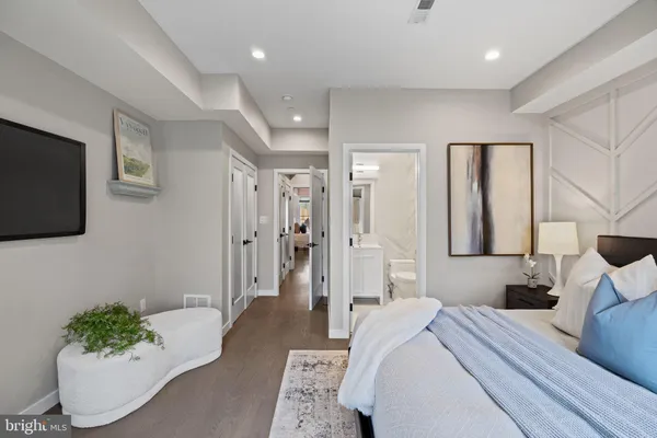 a bedroom with furniture and a chandelier