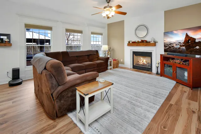 a kitchen with kitchen island granite countertop a sink appliances and cabinets