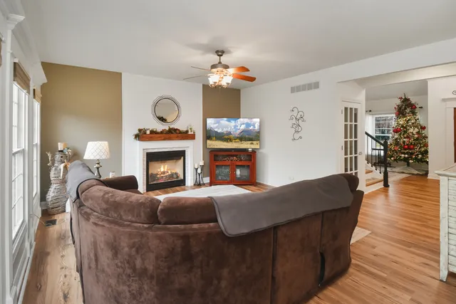 a kitchen with white cabinets and appliances
