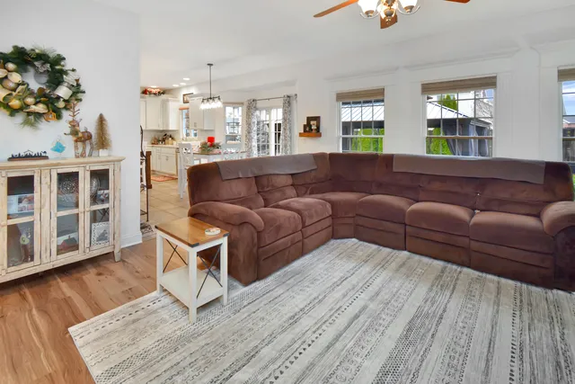 a kitchen with kitchen island a large counter top space and stainless steel appliances