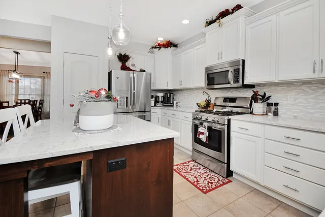 a bathroom with a sink tub and a mirror