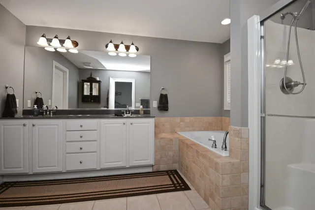 a living room with furniture and a mirror
