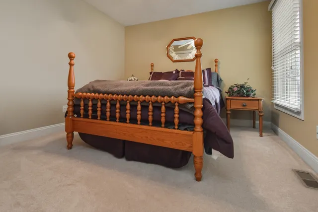 a view of a hallway with furniture