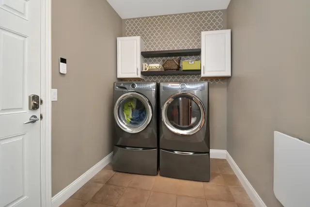 a kitchen with granite countertop a sink appliances and cabinets